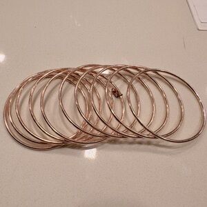 Set of 10 rose gold bangles